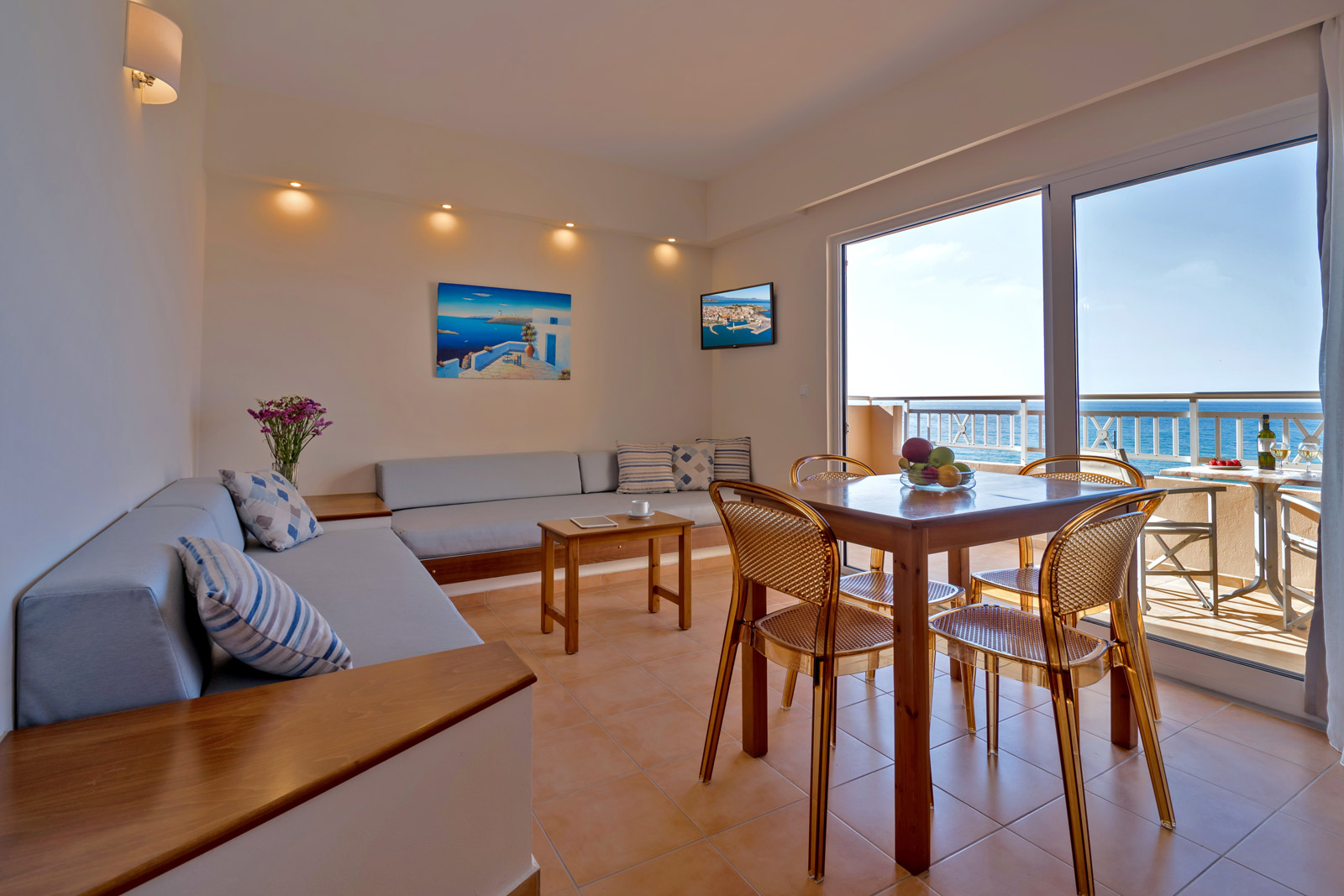 Suite roomwith sea view balconi, sofa and table